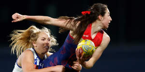 Melbourne’s Alyssa Bannan is tackled by Lulu Pullar of the Kangaroos. 