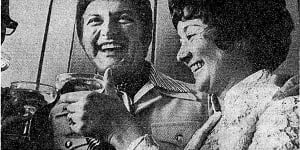“Liberace toasts the blushing bride,Mrs L. Singer,at her airport wedding reception yesterday.”