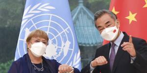 United Nations High Commissioner for Human Rights Michelle Bachelet was criticised for not confronting China during her visit there in May. In this photo,she is meeting Chinese Foreign Minister Wang Yi in Beijing in May.