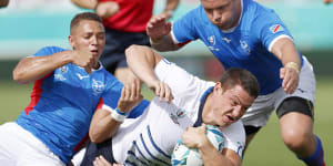 Namibian players bring down Italy’s Luca Morisi during their Rugby World Cup Pool B game in Osaka on Sunday.