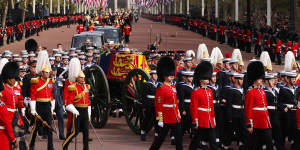 LONDON,ENGLAND - SEPTEMBER 19:The Queen's funeral cortege borne on the State Gun Carriage of the Royal Navy travels along The Mall on September 19,2022 in London,England. Elizabeth Alexandra Mary Windsor was born in Bruton Street,Mayfair,London on 21 April 1926. She married Prince Philip in 1947 and ascended the throne of the United Kingdom and Commonwealth on 6 February 1952 after the death of her Father,King George VI. Queen Elizabeth II died at Balmoral Castle in Scotland on September 8,2022,and is succeeded by her eldest son,King Charles III. (Photo by Dan Kitwood/Getty Images)
