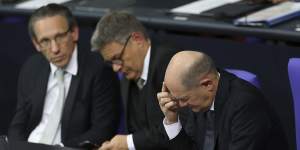 German Chancellor Olaf Scholz (right),Economy and Climate Action Minister Robert Habeck and German Finance Minister Joerg Kukies (left) attend debates before Scholz lost a vote of confidence at the Bundestag.