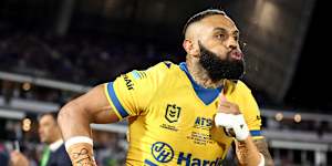 Josh Addo-Carr runs onto the field for his 200th NRL game.