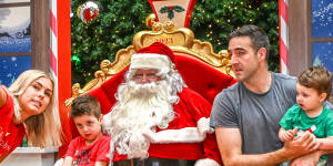 Morihovitis with Santa,Tom Dowse and his sons Sam,left,and Alex.