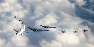 An RAAF Wedgetail flies in formation with Australian and US jets in a file photograph.
