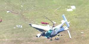 Wreckage strewn near the Caboolture airfield after two light planes crashed on Friday morning.