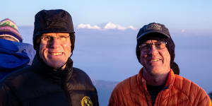 Hillary,left,and Balderstone in 2018 at dawn atop Tiger Hill near Darjeeling,India,in the eastern Himalayas. In the background:the world’s third-highest mountain,Kanchenjunga (8586 metres).