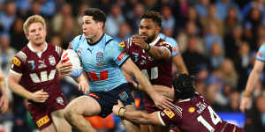 Mitchell Moses makes the break to seal the match and the series for NSW.