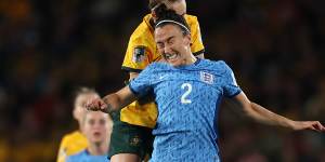 England’s Lucy Bronze heads the ball away from Caitlin Foord.