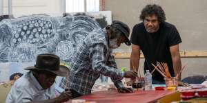 Namatjira (right) mentoring artists Alec Baker and Eric Barney for the NGV’s My Country exhibition.