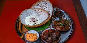 The hopper set includes rice flour pancakes,two curries and sambols.