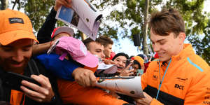 Oscar Piastri greets fans at Albert Park during the Australian Grand Prix.