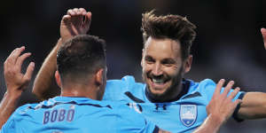 Milos Ninkovic celebrates with Bobo but was later taken off with injury.