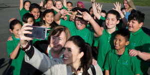 Ardern poses for a selfie with students in Christchurch.