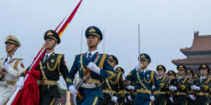 The Guard of Honor of the Chinese People’s Liberation Army escorts the Chinese national flag in Beijing on China’s Army Day on August 1,2022,