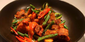 Must-try:Wok-fried pork belly with red curry paste,beans and kaffir lime leaf.