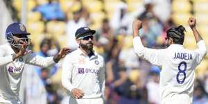 India’s Ravindra Jadeja (right) celebrates the wicket of Peter Handscomb during the first day of the first Test in Nagpur.