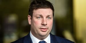 Opposition MP Tim Smith faces the media after crashing his car on Saturday night and recording an alcohol reading of more than twice the legal limit.