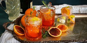 Aperol spritz with champagne,blood orange and rosemary.