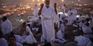 A pilgrim prays atop Mount Arafat during the Haj.