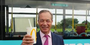 Nigel Farage holds a milkshake after the incident.