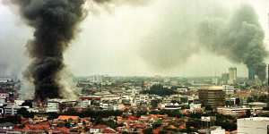 Smoke rises from burning buildings during Jakarta's unrest in May 1998.