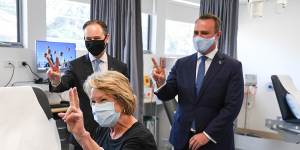 Health Minister Greg Hunt,patient Dale Austin,and Liberal MP Tim Wilson at a vaccination in Sandringham.