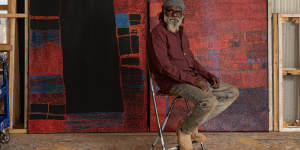 Noli Rictor,winner of the 2024 Telstra National Aboriginal and Torres Strait Islander Art Awards,with his work.