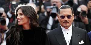 Johnny Depp arrives on the red carpet at Cannes for the opening night premiere of Jean du Barry,alongside director Maiwenn.
