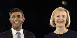 All smiles... Rishi Sunak and Liz Truss at the final hustings of the seven-week grassroots campaign.
