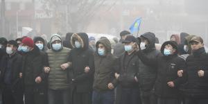 Demonstrators stand in front of police line during a protest in Almaty,Kazakhstan.