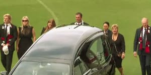 Shane Warne’s children Jackson,Brooke and Summer;brother Jason;and parents Brigitte and Keith accompany his coffin on a lap of honour.