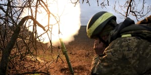 Soldiers with the Ukrainian army’s 68th Brigade fire a mortar at Russian positions in the Donetsk region.