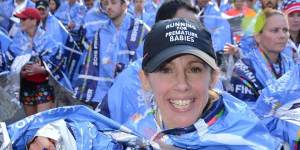 Fundraising champion Sophie Smith crosses the finish line in the New York Marathon,2016.