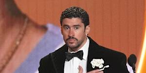 Bad Bunny accepts the award for album of the year for Debi Tirar Mas Fotos.