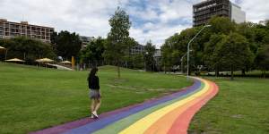 A pedestrian on the rainbow path at Prince Alfred Park on Monday.