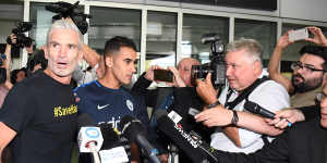 Craig Foster and media flank Hakeem al-Araibi on his return to Australia.