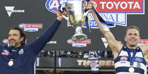 Joel Selwood and Chris Scott celebrate the Cts’ premiership win.