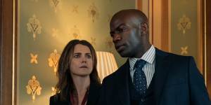 Kate Wyler (Keri Russell) and Austin Dennison (David Gyasi) walk the halls of power in The Diplomat.