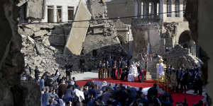 Pope Francis leads a prayer for the victims of war at Hosh al-Bieaa Church Square in Mosul in 2021.