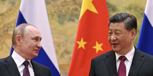 Chinese President Xi Jinping,right,and Russian President Vladimir Putin talk to each other in 2022.