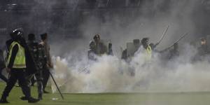 Three police commanders have been detained over the firing of tear gas at the stadium.