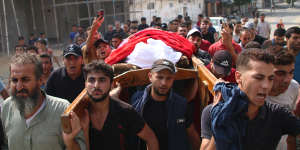 Family and friends mourn a Palestinian man in Gaza City on Sunday.