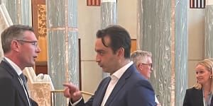 RTBU national secretary Mark Diamond speaks with NSW Premier Dominic Perrottet in Parliament House on Thursday.