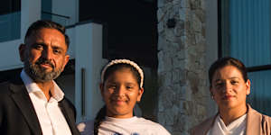 Raj and Aman Mangat with their youngest daughter Iskara and dog Simba in Box Hill.