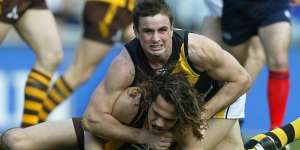 Richmond’s Ty Zantuck tackles Hawthorn’s Mark Williams in round 21,2004.