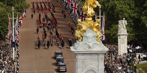 The procession makes its way from Buckingham Palace to Westminster Hall.