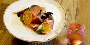 Tea-smoked salmon belly is paired with a sweet beetroot lime meringue.