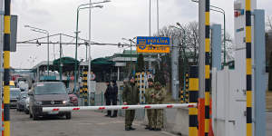 Ukrainian citizens flee the Russian aggression across the Shehyni-Medyka checkpoint at the Ukraine-Poland border.