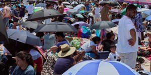 Crowds gathering at Opera House forecourt.